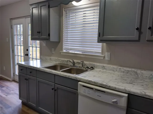 a kitchen with a sink and cabinets