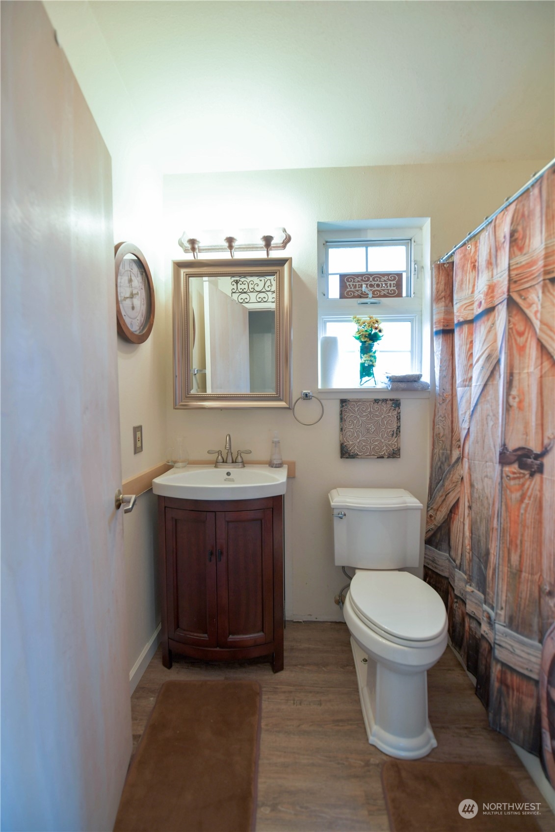 1151 Redmond Avenue Northeast Renton, WA 98056 - Photo 18 of 23 a bathroom with a toilet a sink and mirror