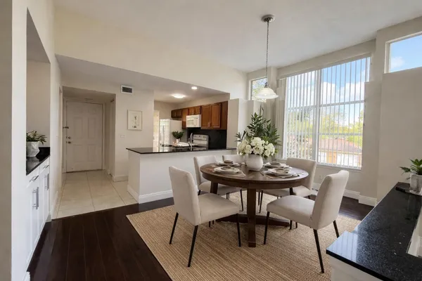 a view of a dining room with furniture window and wooden floor