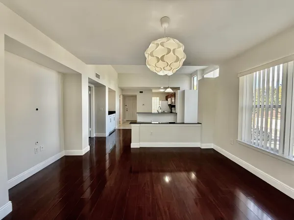 an empty space with wooden floor