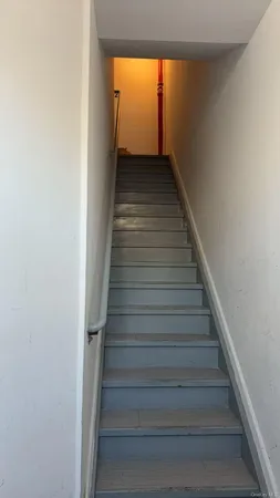 a living room with a couch and a gate