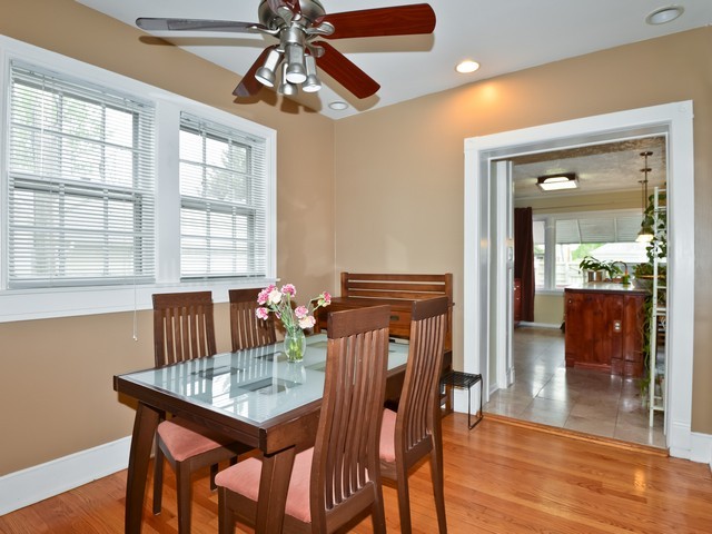 6015 West Barry Avenue Chicago, IL 60634 - Photo 4 of 10 a view of a dining room with furniture window and wooden floor
