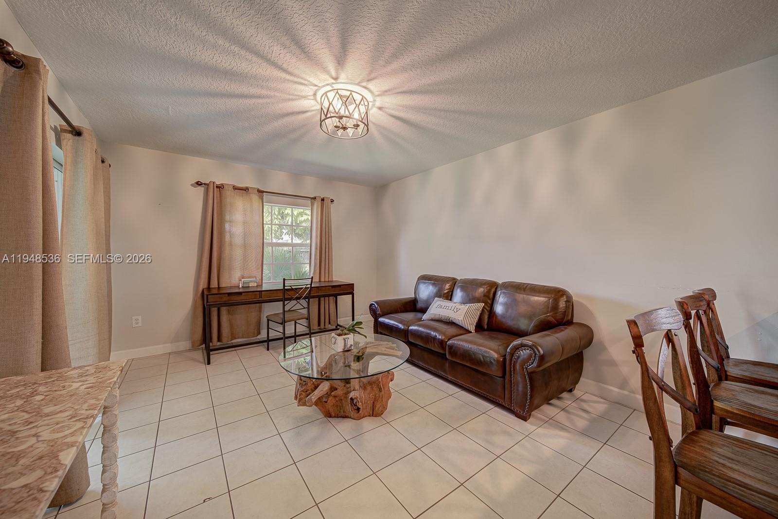 18128 Southwest 151st Avenue Miami, FL 33187 - Photo 25 of 39 a living room with furniture