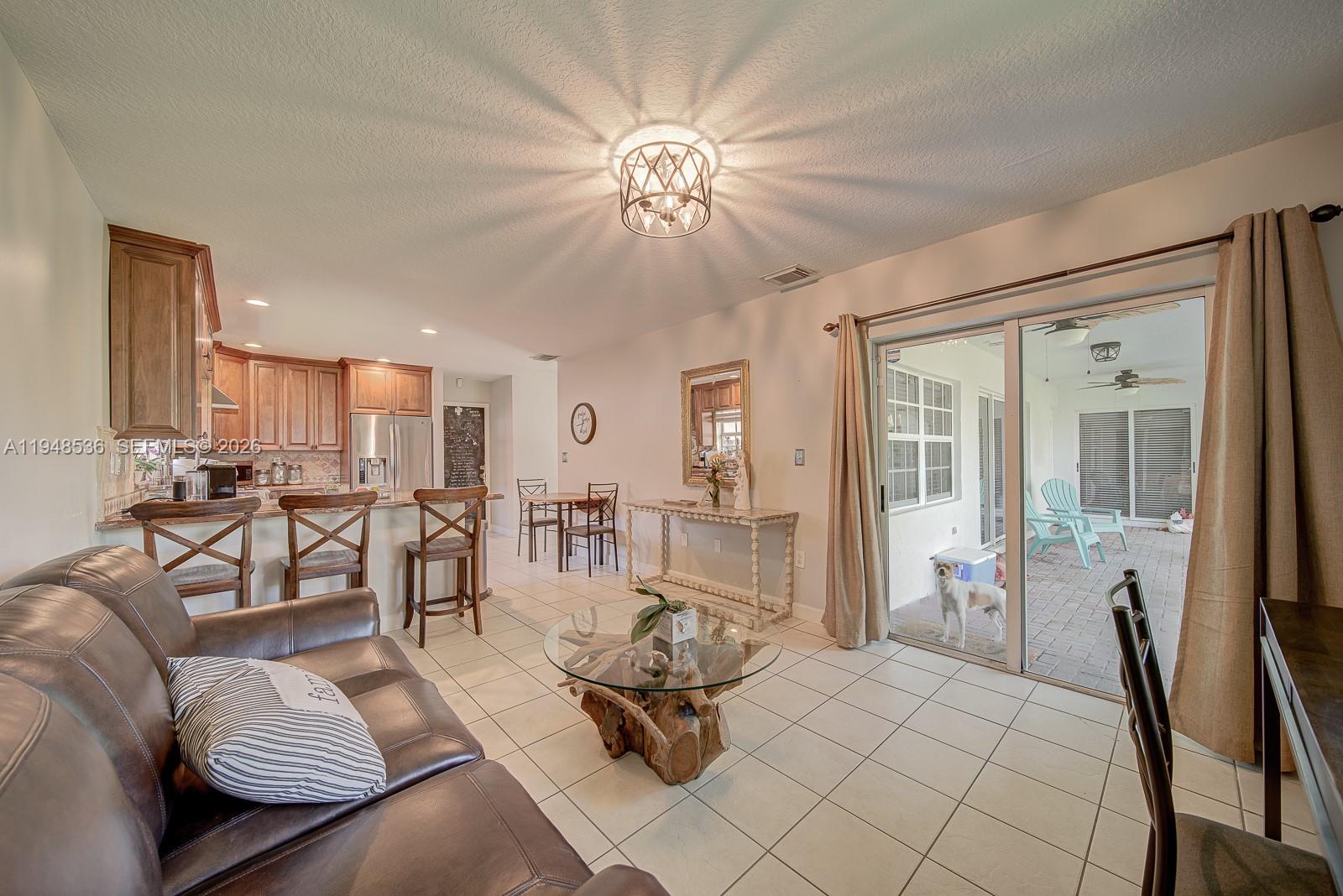 18128 Southwest 151st Avenue Miami, FL 33187 - Photo 28 of 39 a bedroom with furniture and large window