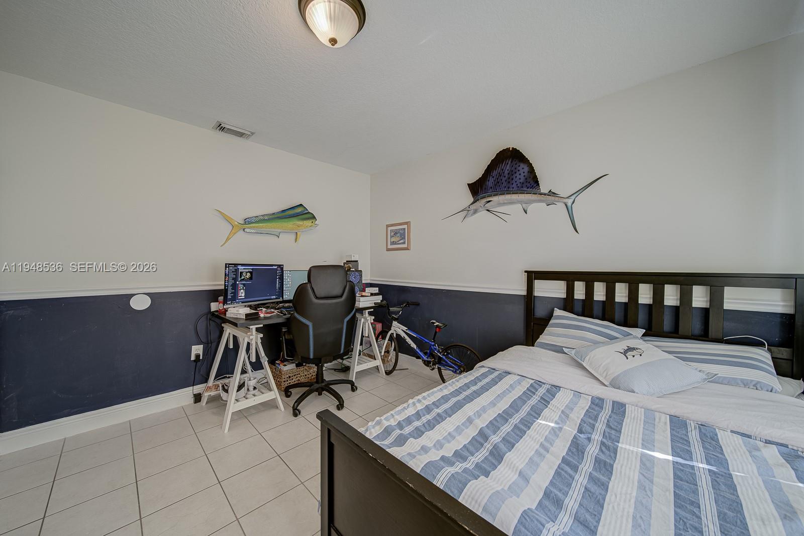18128 Southwest 151st Avenue Miami, FL 33187 - Photo 7 of 39 a bed room with a bed and chair