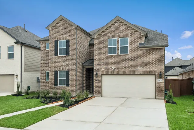 a view of a hallway with wooden floor and entryway