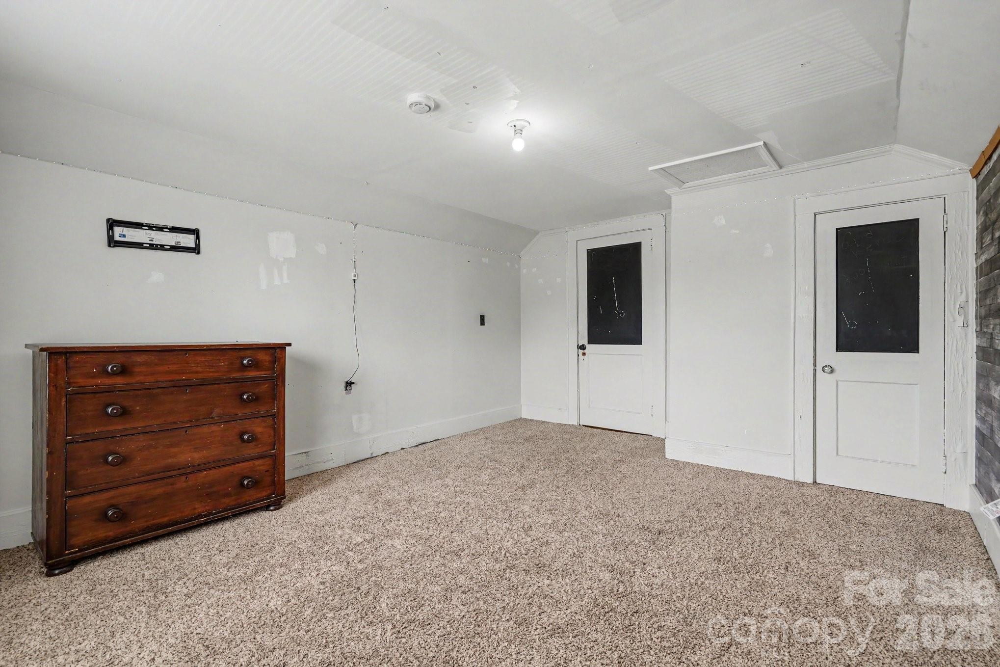 24359 Ridgecrest Road Locust, NC 28097 - Photo 16 of 26 a view of room with cabinet and mirror