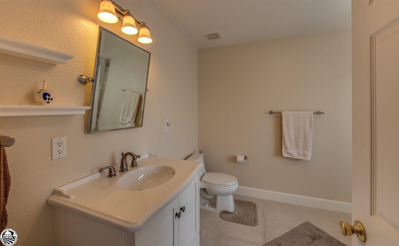1618 Cheyenne Road Copperopolis, CA 95228 - Photo 18 of 30 a bathroom with a toilet sink and mirror