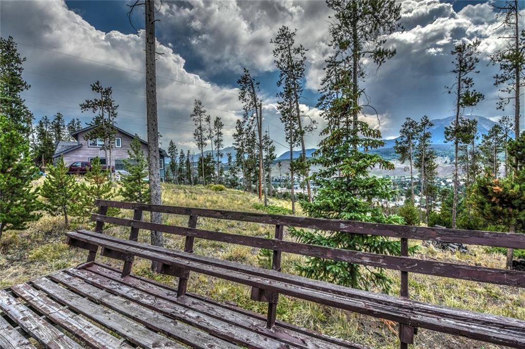 119 N Road Silverthorne, CO 80498 - Photo 22 of 25 a view of a wooden bench next to a lake