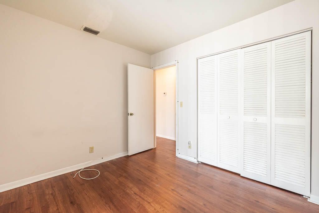 231 Northwest 15th Street Boca Raton, FL 33432 - Photo 3 of 22 a view of an empty room with wooden floor