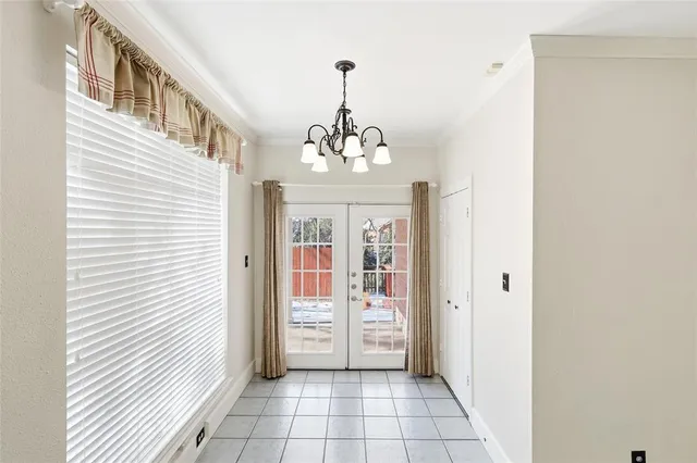 a view of a hallway with entryway door front door