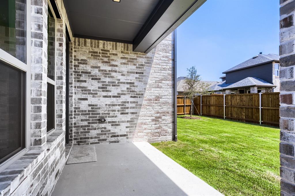 828 Stone Grv Road Lavon, TX 75166 - Photo 23 of 27 Covered patio with concrete flooring