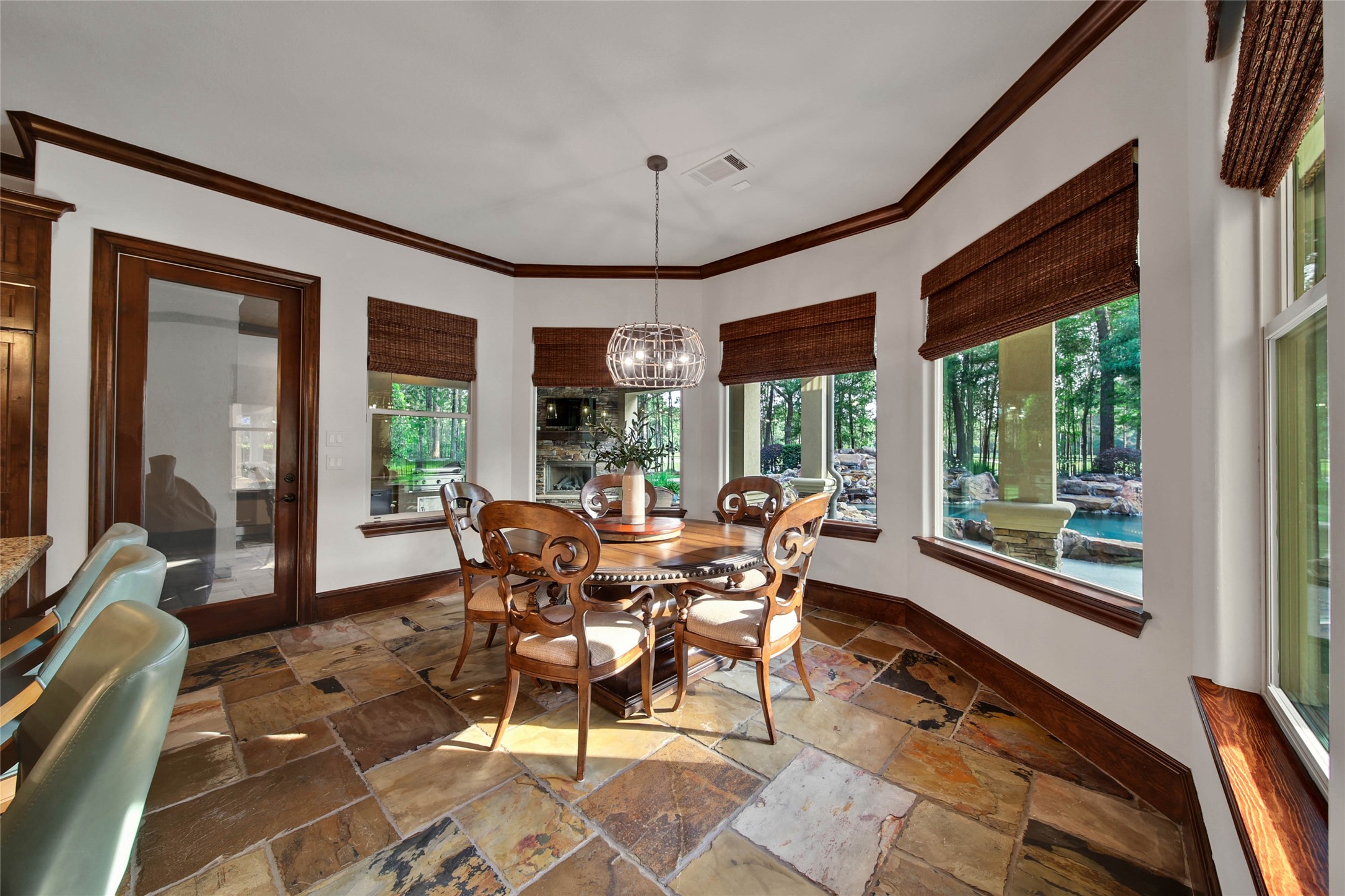 852 Eagle Pointe Montgomery, TX 77316 - Photo 17 of 48 a dining room with furniture a rug and a large window