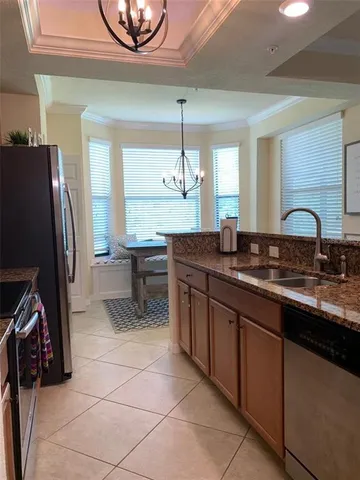 a kitchen with a sink appliances and a counter top space