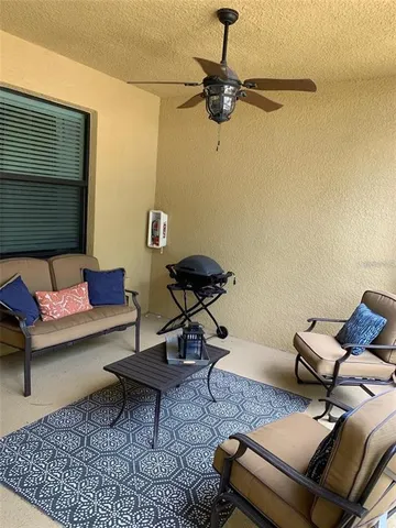 a living room with furniture and a rug