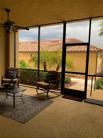 a living room with large windows