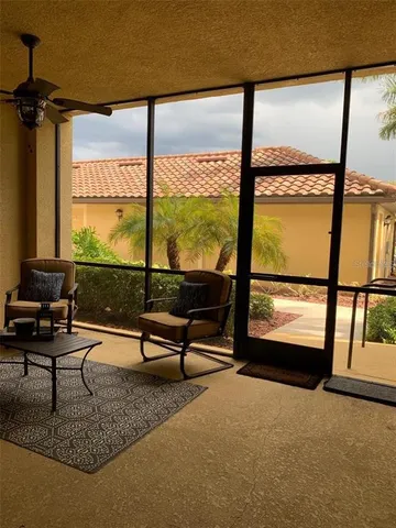 a living room with large windows
