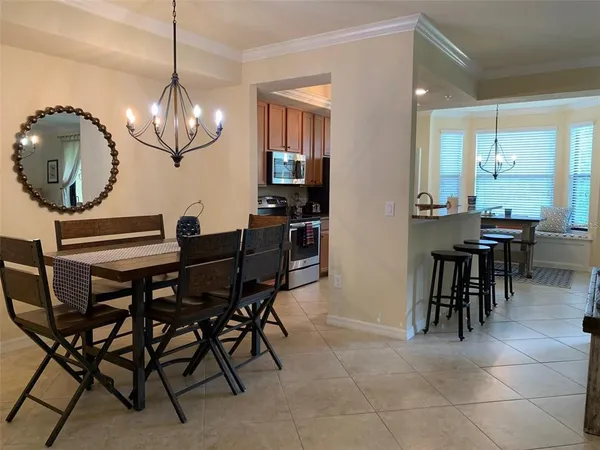 a view of a dining room with furniture window and outside view