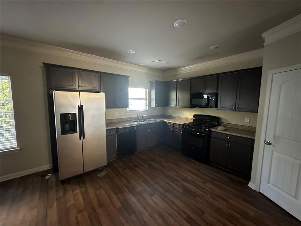 346 Turtle Creek Drive Winder, GA 30680 - Photo 5 of 11 a kitchen with granite countertop a refrigerator stove and sink