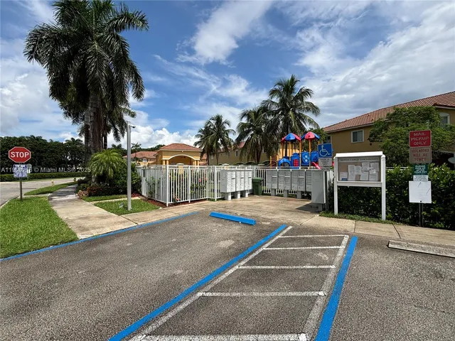 a view of a house with basketball court