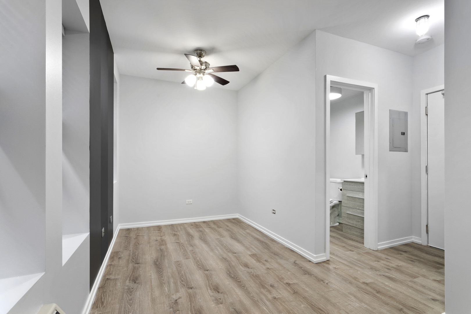 4875 North Magnolia Avenue, Unit 112 Chicago, IL 60640 - Photo 3 of 12 a view of empty room with wooden floor