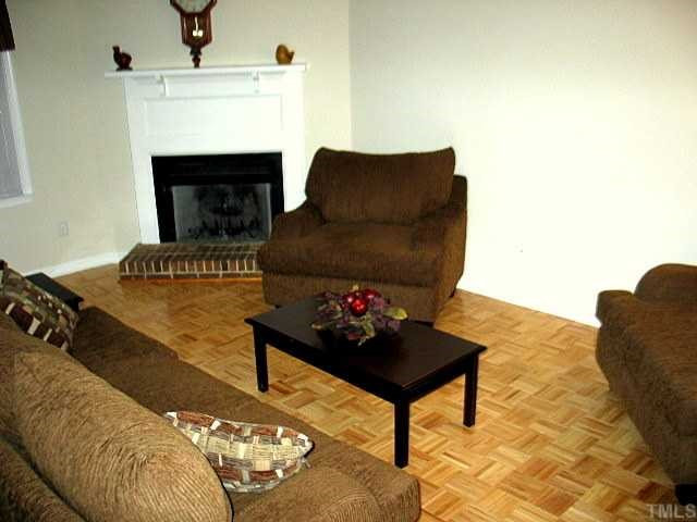 Another view of the living room features parque wood flooring and crown moldings, Living Room