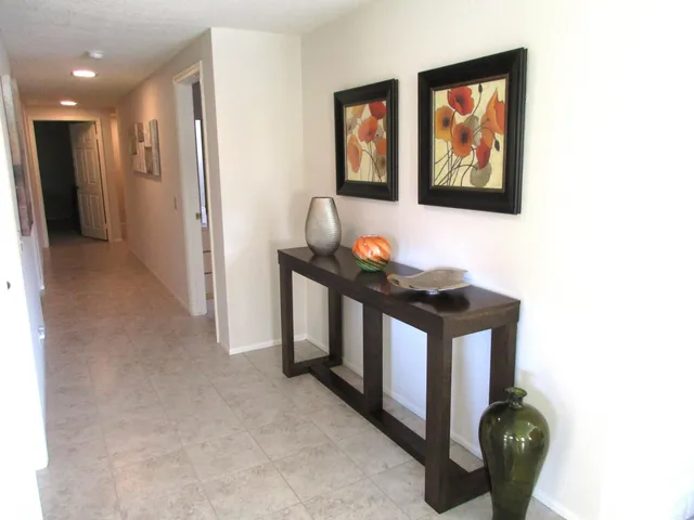 a kitchen with stainless steel appliances granite countertop a stove a refrigerator and a microwave