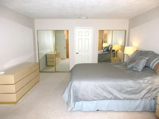 a bed room with a bed and a couch