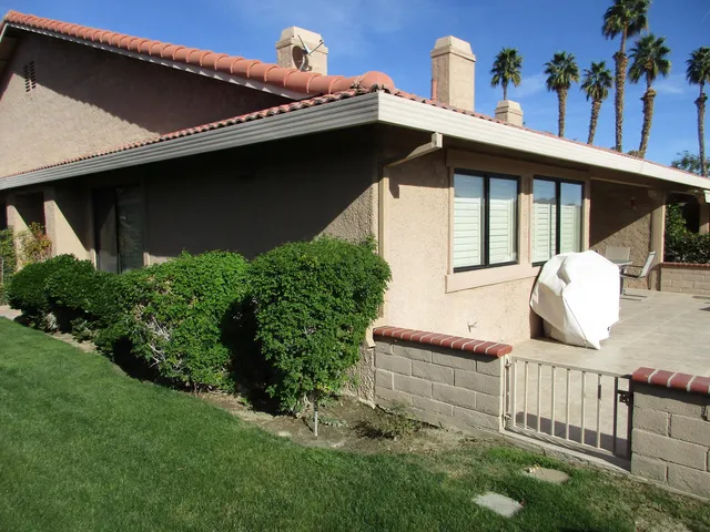 a view of a porch with a small yard