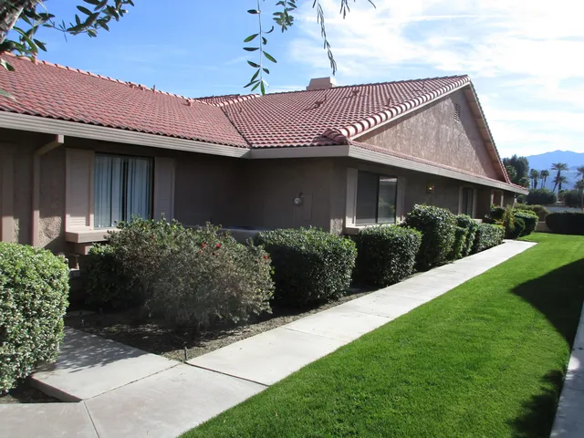 a view of a house with a garden