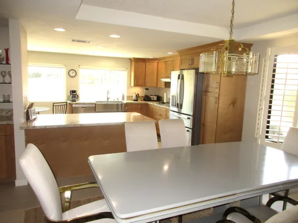 a view of a living room and kitchen view