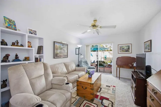 a living room with furniture a couch and a window