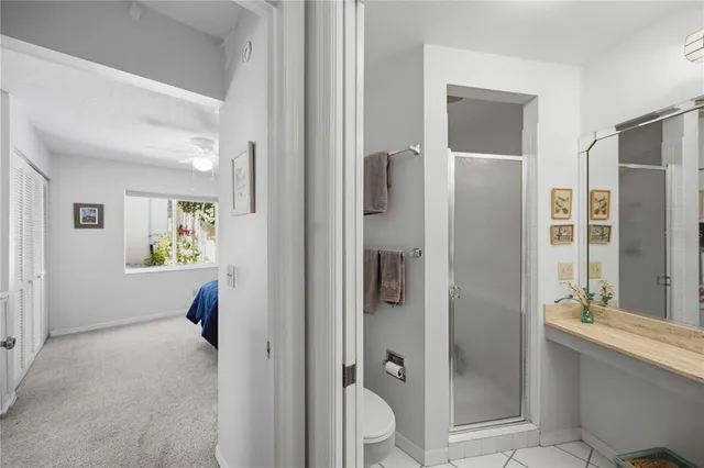 a view of a bathroom with a tub and shower