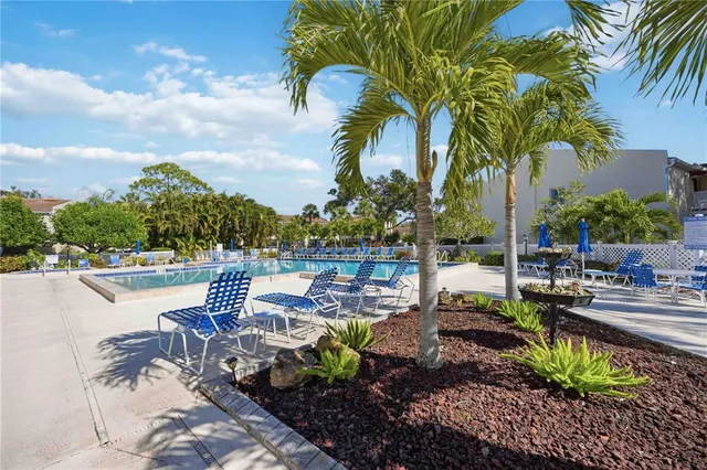 a view of a lake with a table and chairs