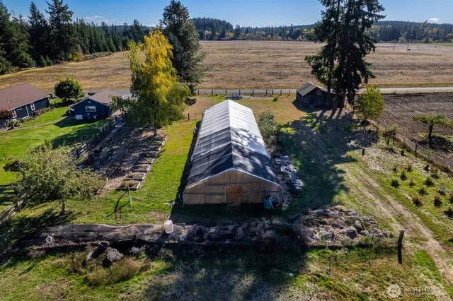 a house view with wooden fence and a trees
