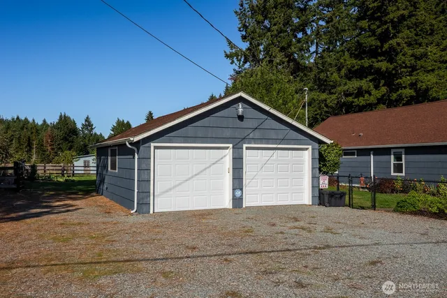 an aerial view of house with a yard