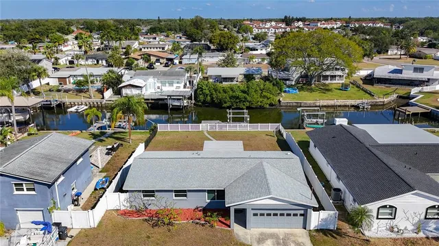 an aerial view of a house with a swimming pool