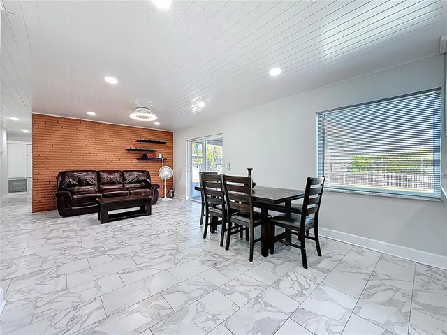a bathroom with a granite countertop toilet sink and a mirror