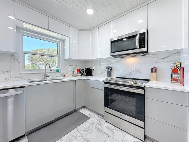 a bedroom with a bed and a desk