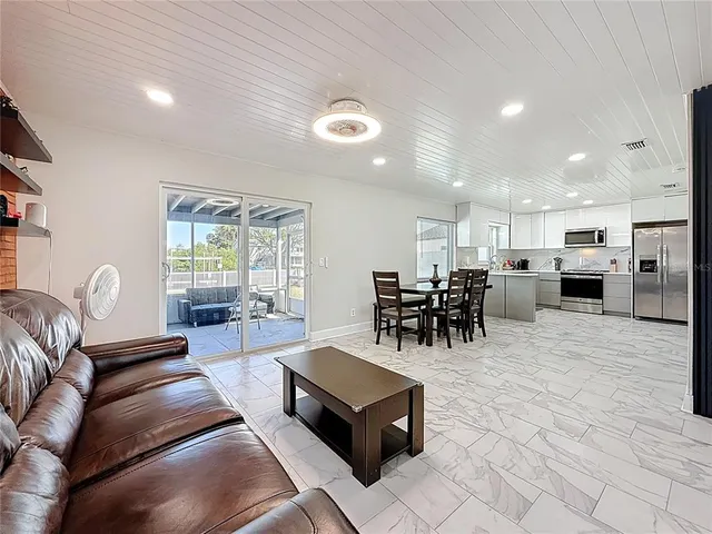 a living room with furniture and a table