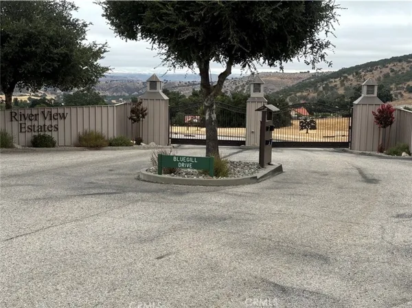 a view of residential houses with outdoor space and mountain view