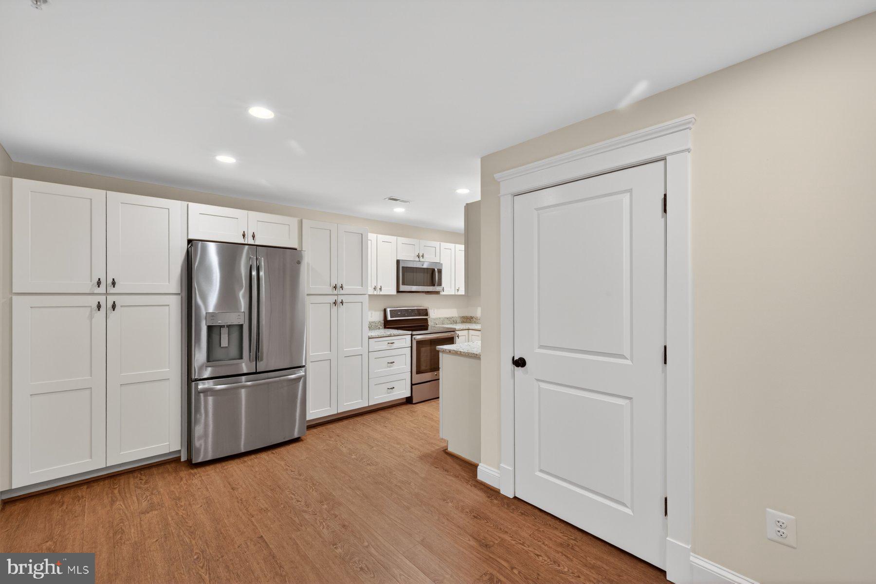5011 Rugby Avenue Bethesda, MD 20814 - Photo 49 of 63 Basement kitchen with stainless steel appliances