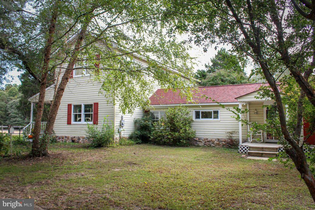 6401 Mackall Road St. Leonard, MD 20685 - Photo 2 of 30 a front view of a house with a yard