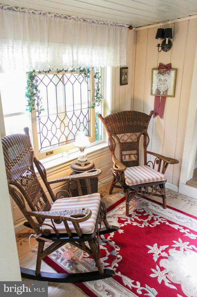 6401 Mackall Road St. Leonard, MD 20685 - Photo 19 of 30 a living room with furniture and a rug