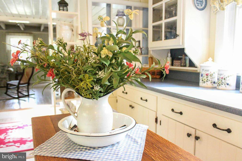 6401 Mackall Road St. Leonard, MD 20685 - Photo 22 of 30 a vase of flowers sitting on a table