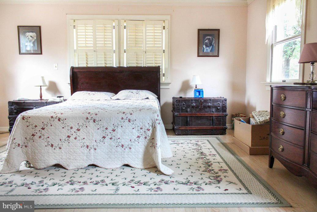 6401 Mackall Road St. Leonard, MD 20685 - Photo 26 of 30 a bedroom with a bed and a window
