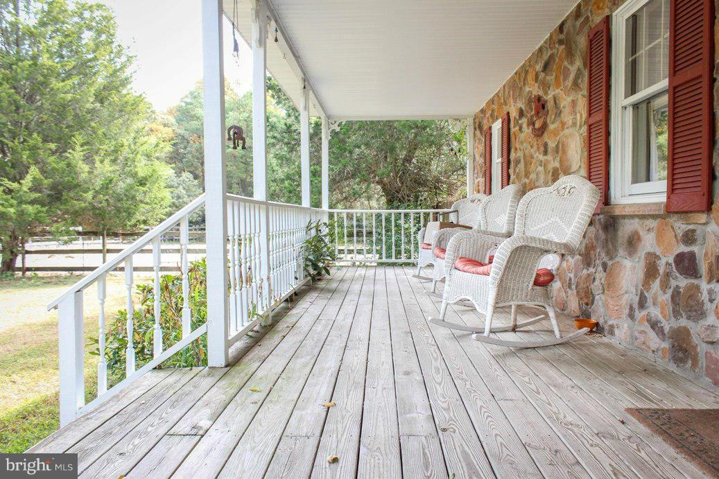 6401 Mackall Road St. Leonard, MD 20685 - Photo 4 of 30 a view of a balcony with wooden floor