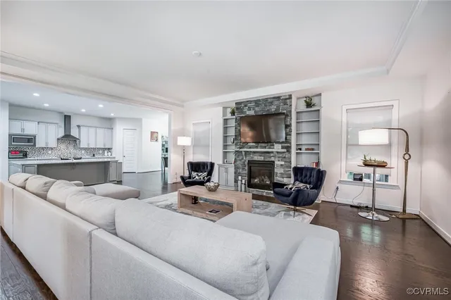 a bathroom with a double vanity sink toilet and a mirror