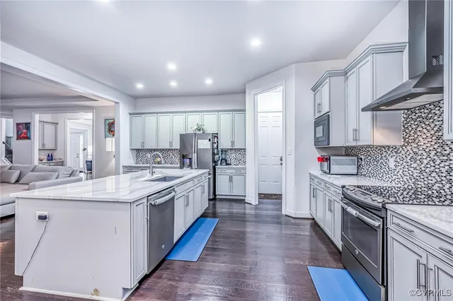 a bedroom with a bed and a desk in it