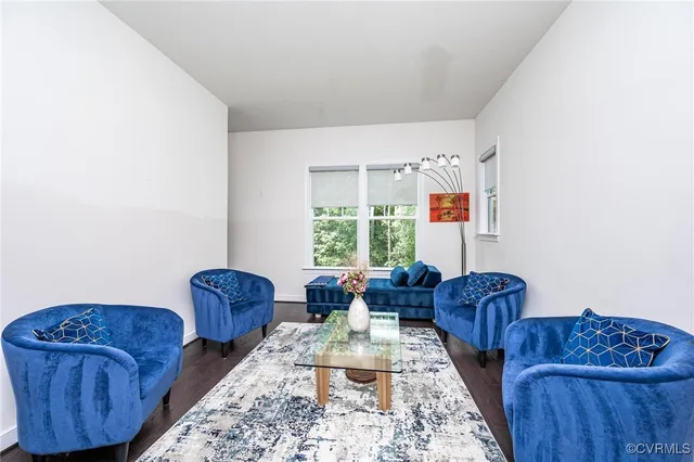 an aerial view of a house with yard and outdoor seating